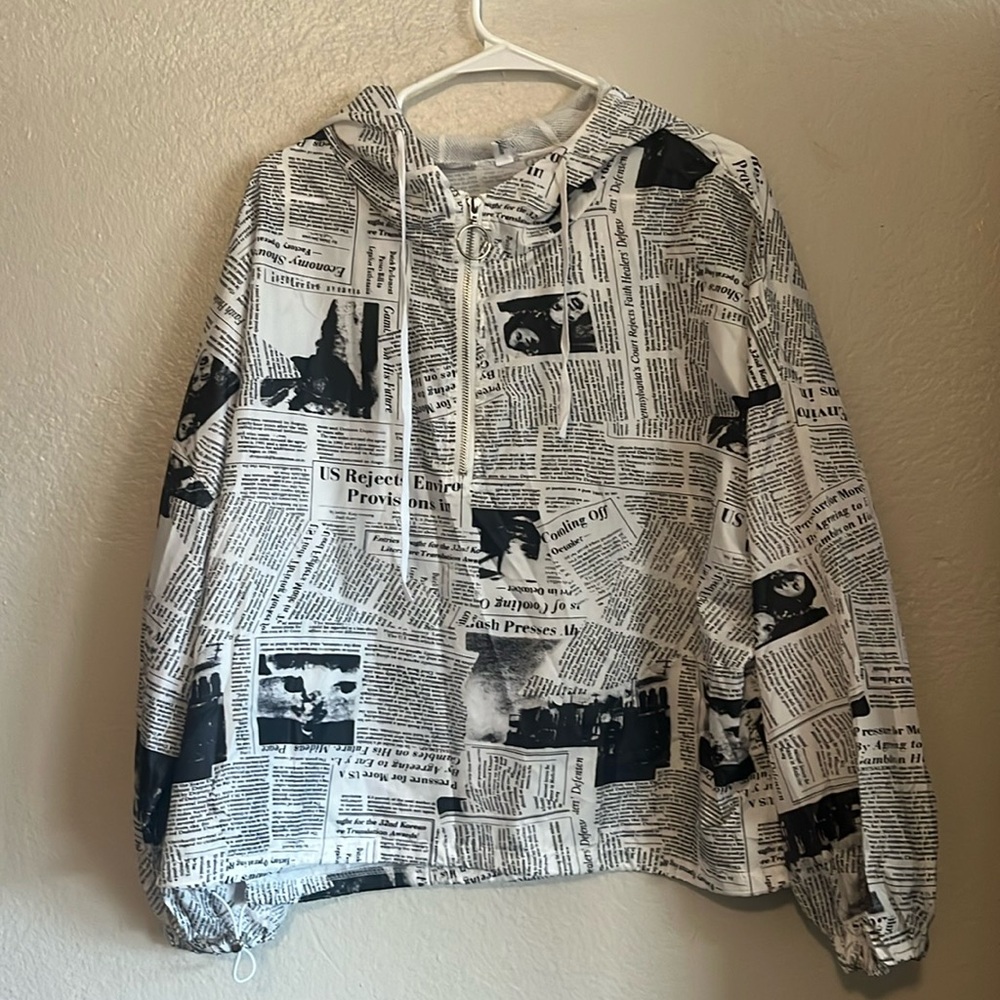 Hooded black and white newsprint windbreaker